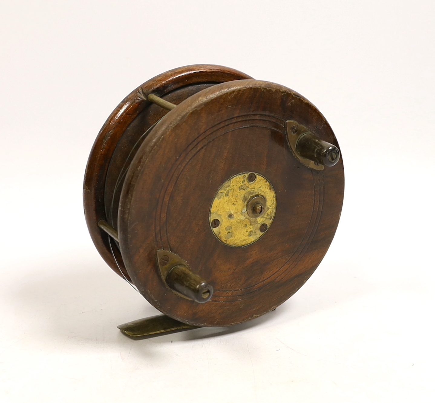 A David Slater patent 5 inch Starback centre pin fishing reel, brass mounted walnut with twin horn handles and drum release catch